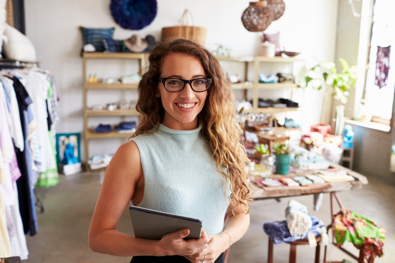 female-business-owner-holding-tablet-computer-in-PEVERD4.jpg